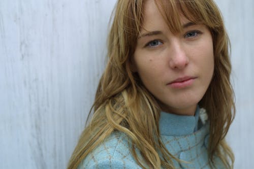 Woman In Blue Turtleneck Top