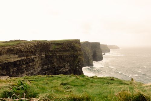 Free The iconic Cliffs of Moher in Ireland showcasing dramatic coastal views and rugged cliffs. Stock Photo