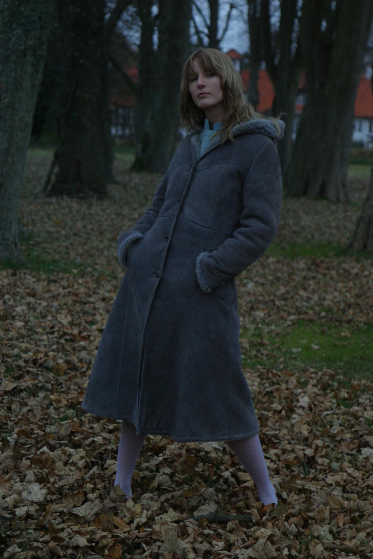 Person enjoying a healthy bowl at a table with notebook and phone