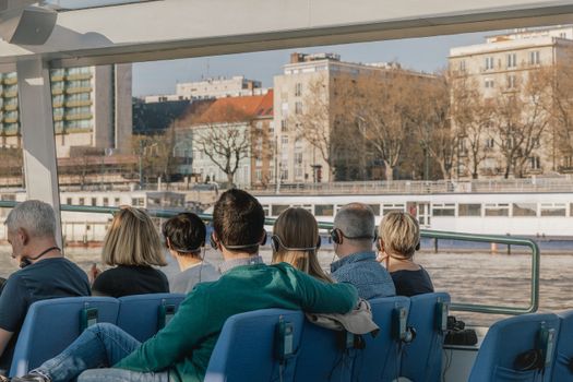 Tourists enjoy a scenic Danube River cruise in Budapest with city views and audio guide.