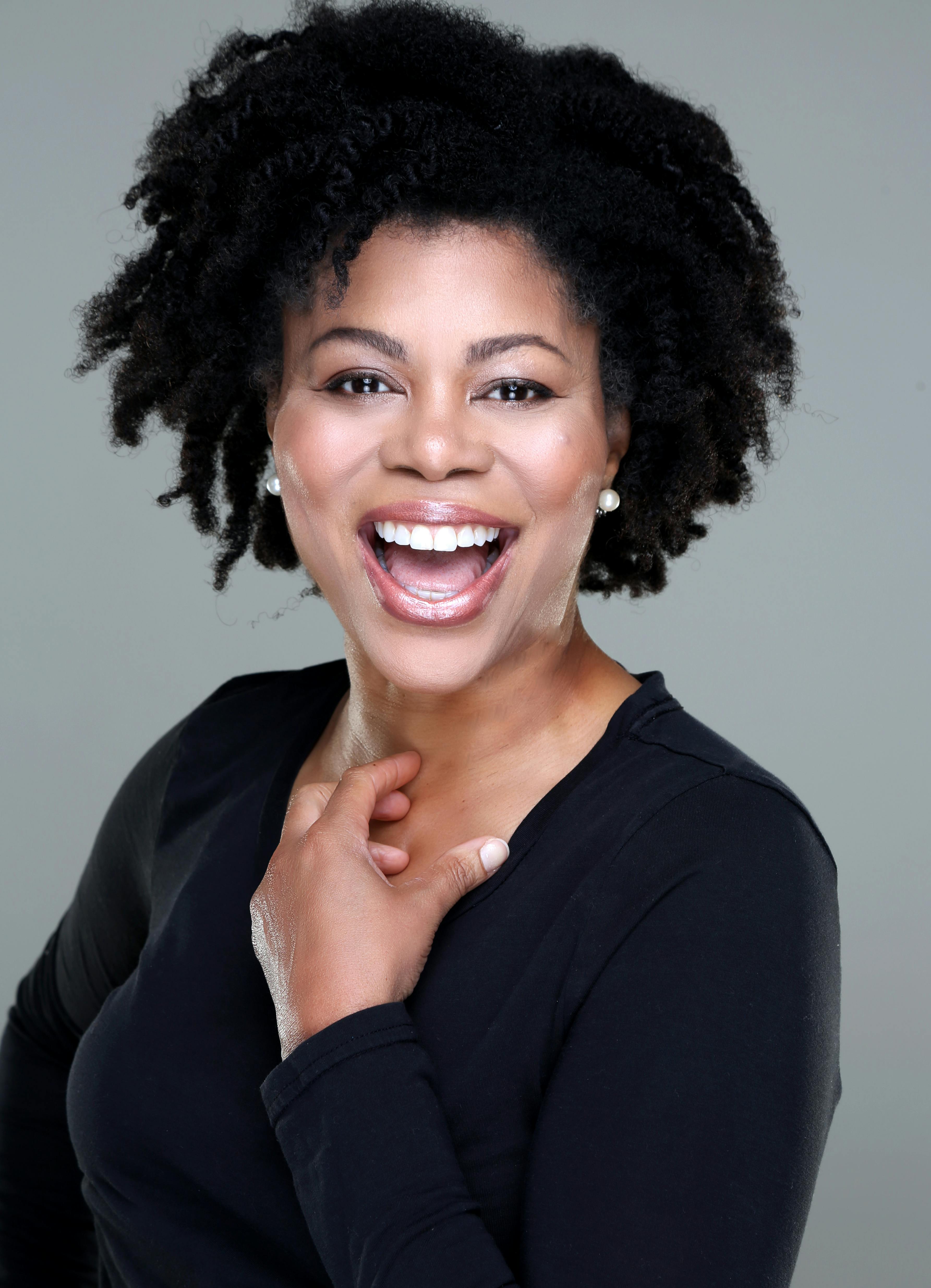 Smiling Woman In Black Long Sleeve Shirt · Free Stock Photo