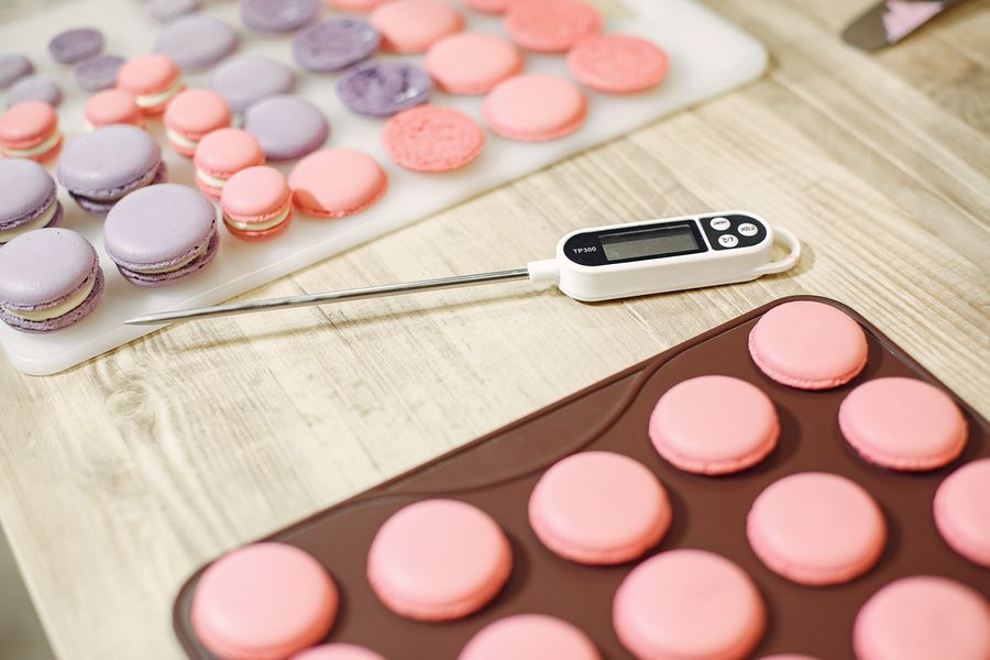 Food thermometer beside prepared food during a temperature check