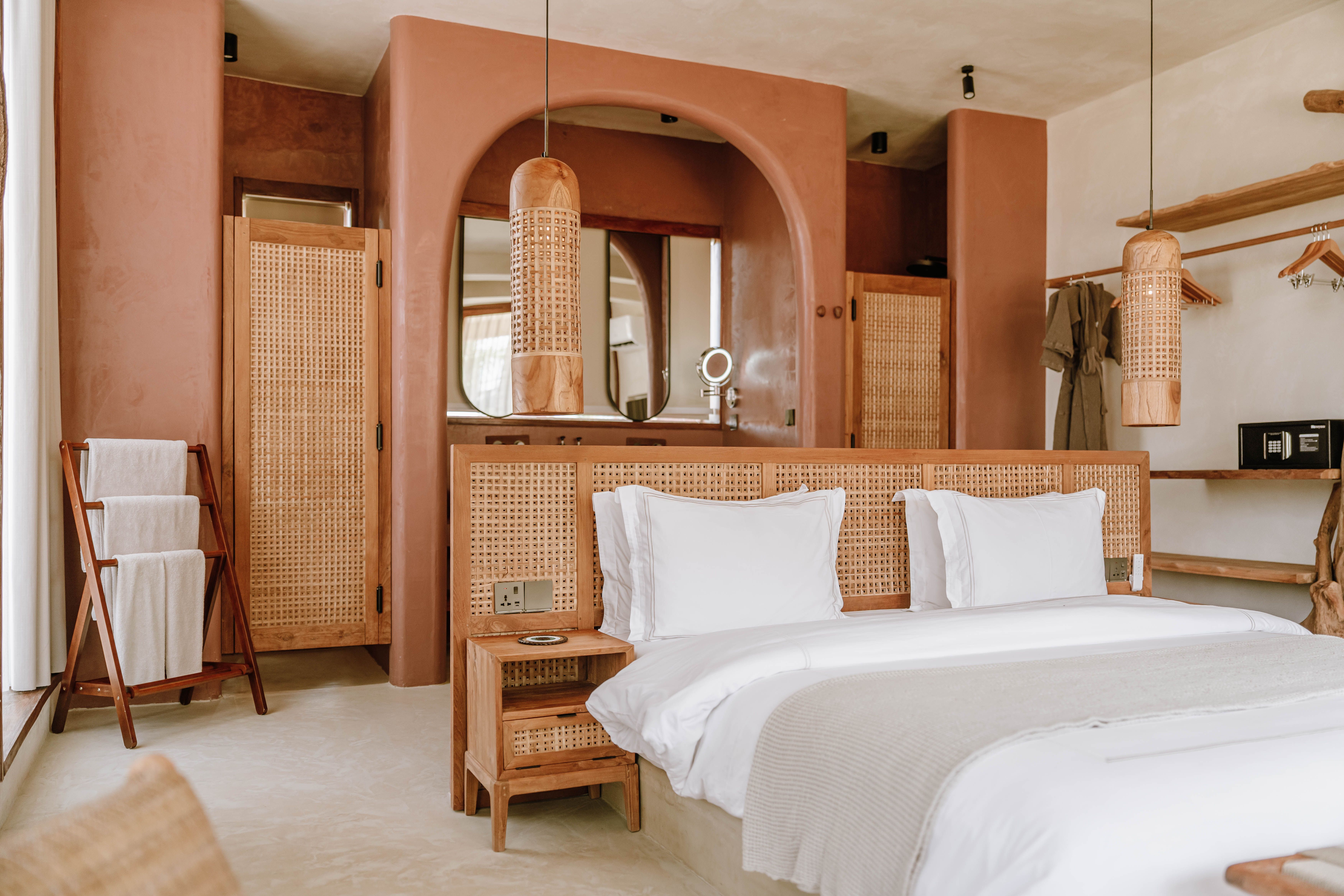 Luxurious boutique hotel room in Jambiani, Zanzibar showcases modern design with natural elements.