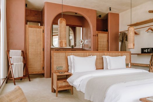 Luxurious boutique hotel room in Jambiani, Zanzibar showcases modern design with natural elements.