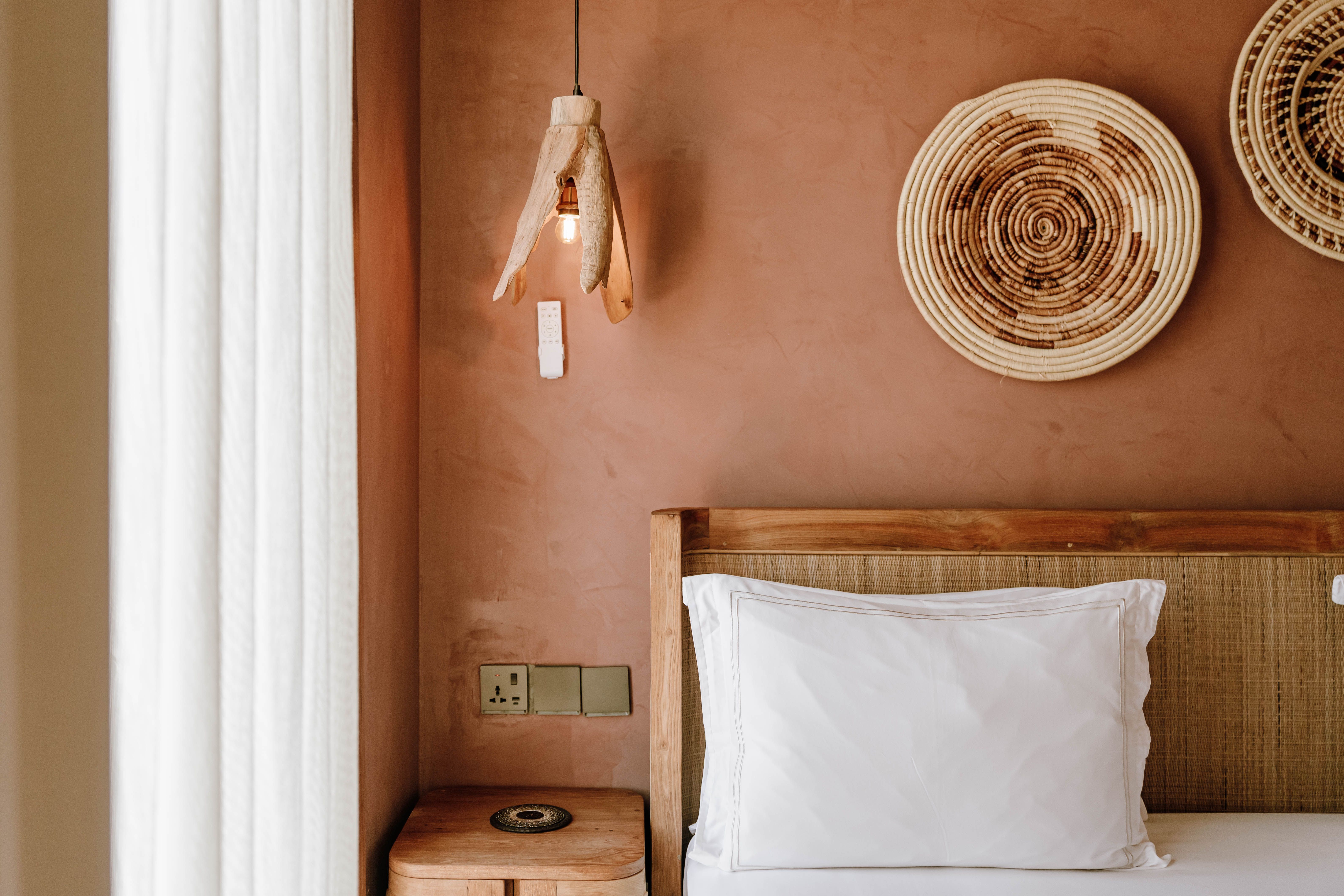 Detailed view of a stylish boutique hotel room in Jambiani, with unique decor and warm tones.