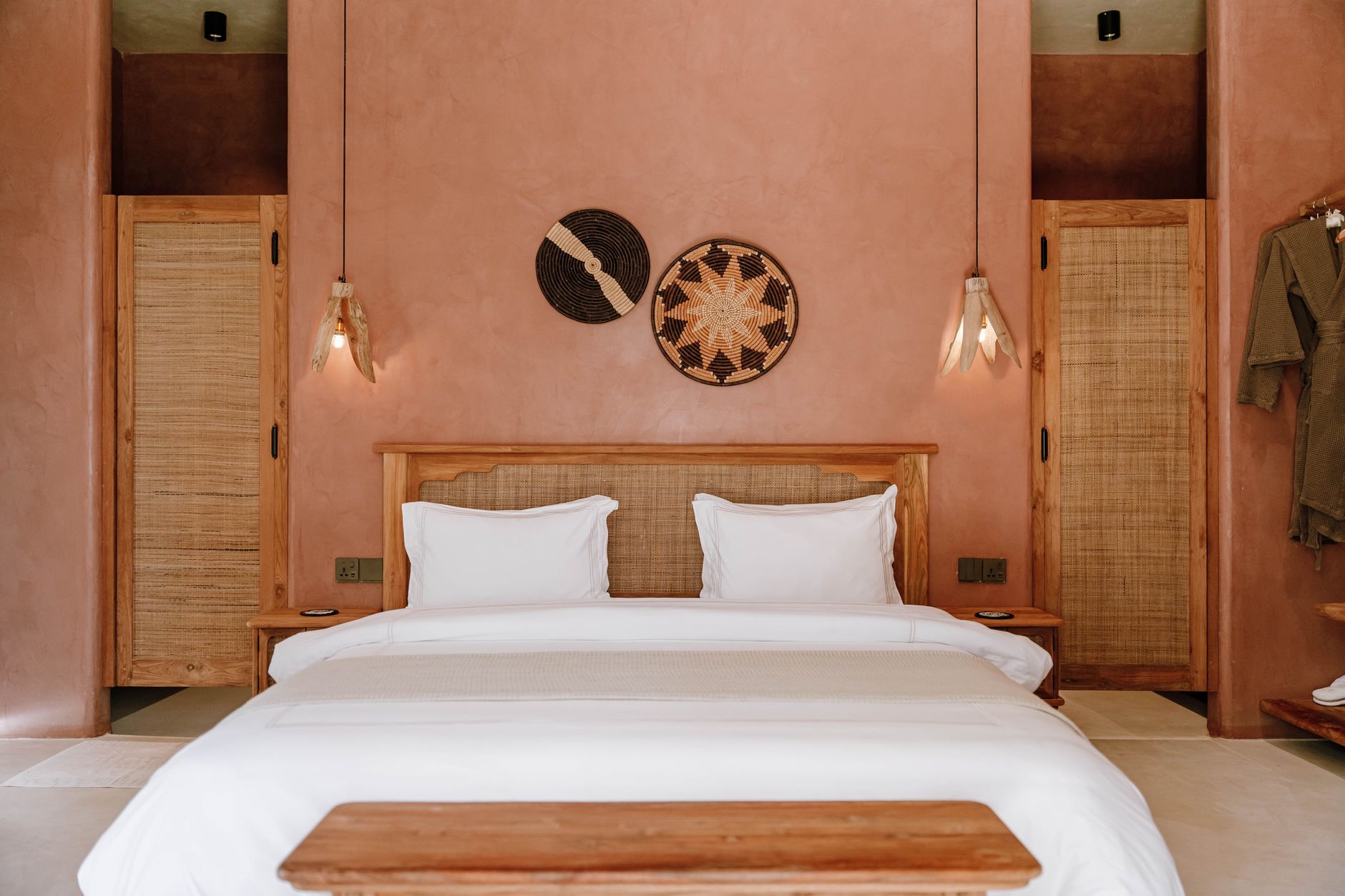 Elegant rustic bedroom design in a boutique hotel in Jambiani, Tanzania.