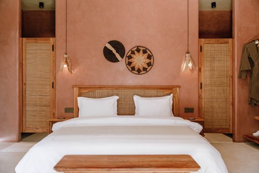 Elegant rustic bedroom design in a boutique hotel in Jambiani, Tanzania.