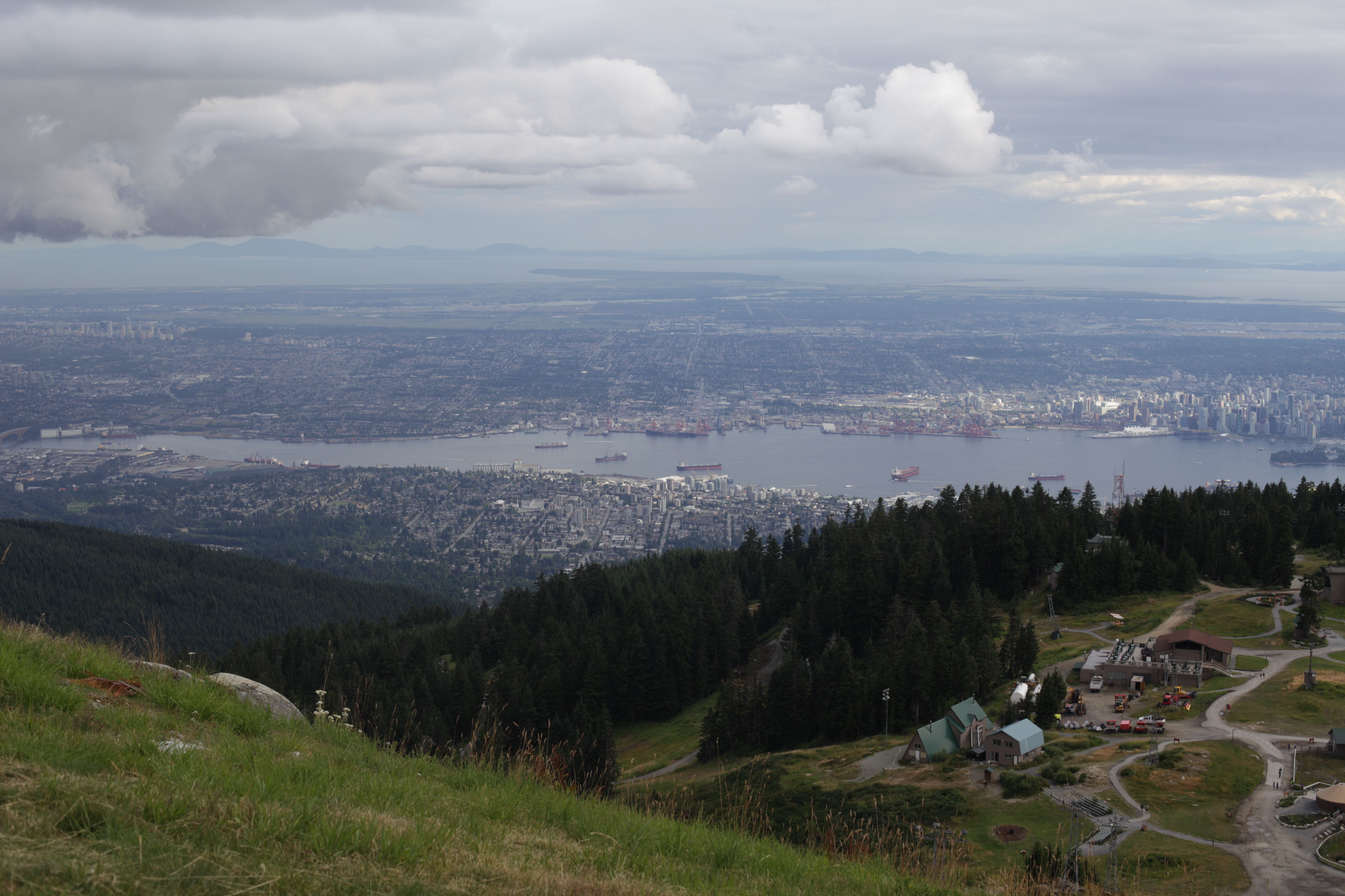 Stunning aerial view of Vancouver and surrounding areas from a mountain top.