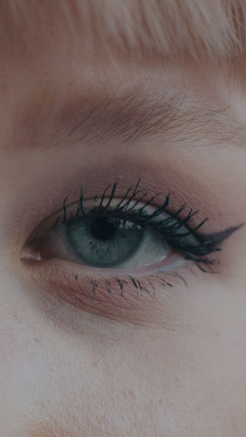 Free Close-up of a human eye with detailed makeup, highlighting eyeliner and lashes. Stock Photo