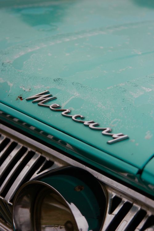Free Detailed view of a vintage Mercury car's front emblem and grill. Stock Photo