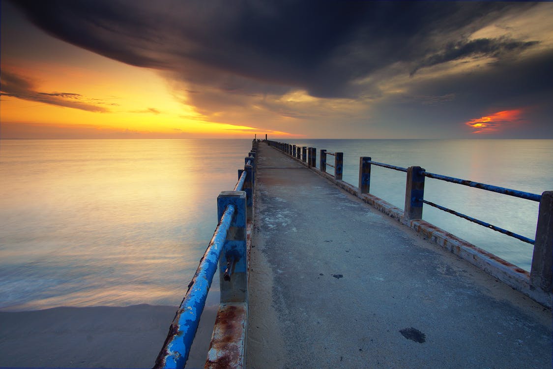 Gray Concrete Dock on Body of Water