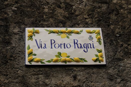 Italian street sign with lemon design in Limone Sul Garda, Lombardy.