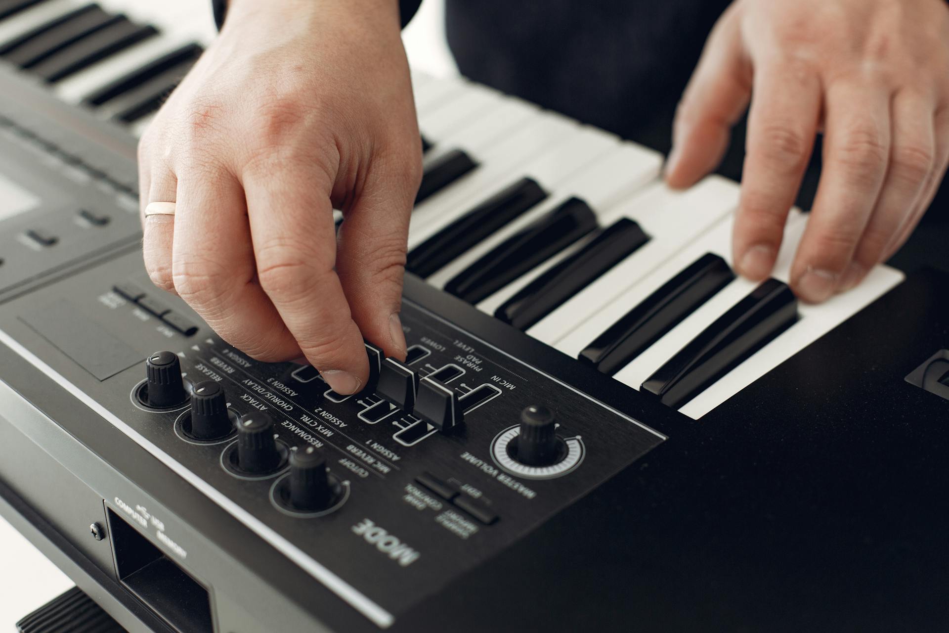 Person Playing Black and White Piano