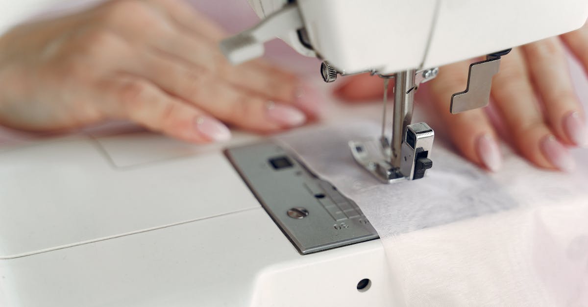 Person Sewing with a White Sewing Machine · Free Stock Photo