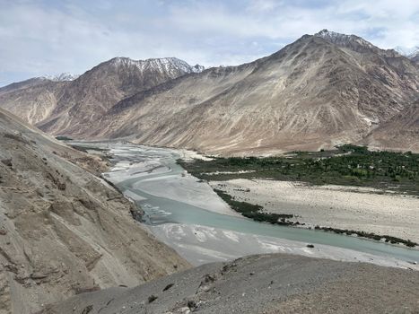 Breathtaking landscape of Nubra Valley, Ladakh with mountains and river.