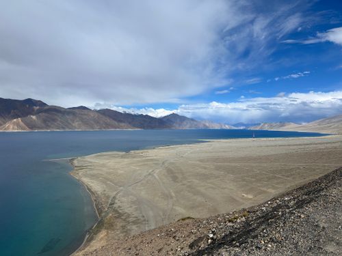 Free Breathtaking view of Pangong Tso Lake and its surrounding mountains under a clear blue sky. Stock Photo