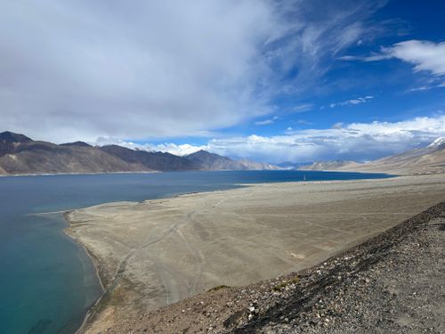 Free Expansive view of Pangong Lake and surrounding mountains in the Himalayas under a clear blue sky. Stock Photo