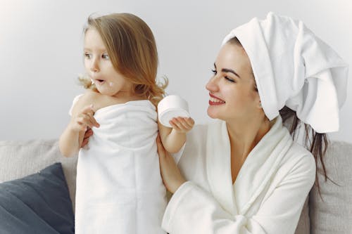 Free Mother and Daughter in Their Bathrobes and Towels Stock Photo