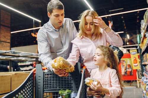 Free Family Doing Shopping in the Grocery Store Stock Photo