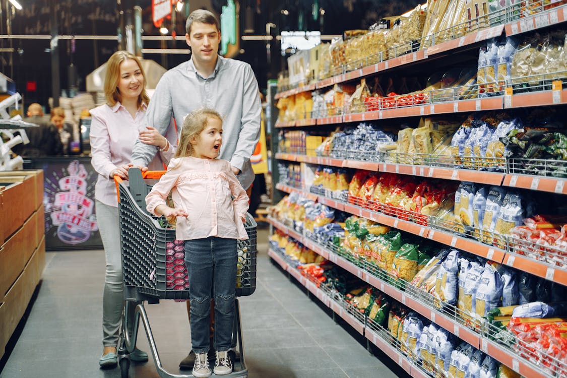 Free Family Doing Shopping in the Grocery Store Stock Photo