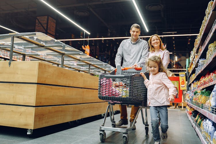 Family Doing Shopping In The Grocery Store