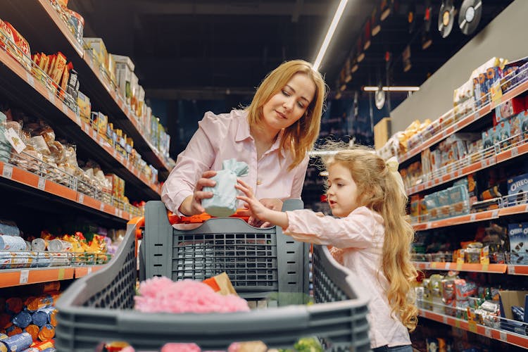 Family Doing Shopping In The Grocery Store