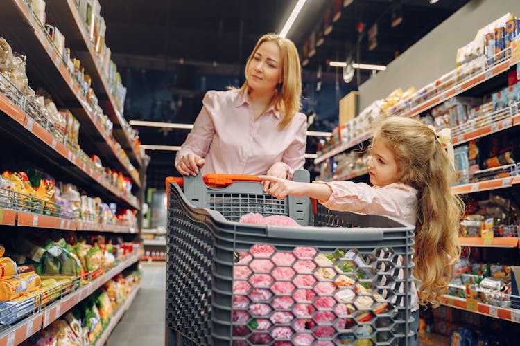 Family Doing Shopping In The Grocery Store