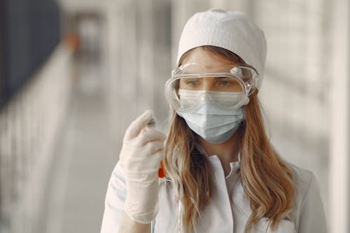 Free Woman in White Long Sleeve Shirt Wearing White Goggles Stock Photo