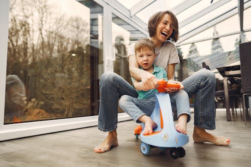 Mother and Son Riding a Twist Car