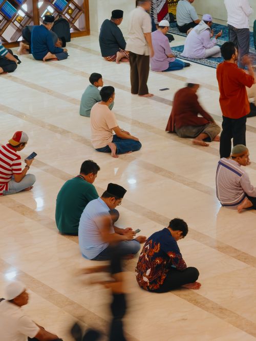 Free A serene moment of men praying in a Jawa Barat mosque, captured indoors with natural lighting. Stock Photo