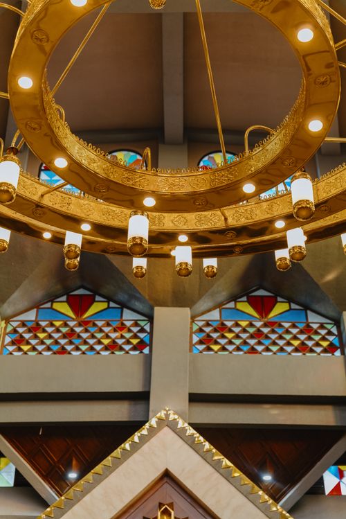 Free Golden chandelier in a mosque interior with stained glass windows, Jawa Barat. Stock Photo