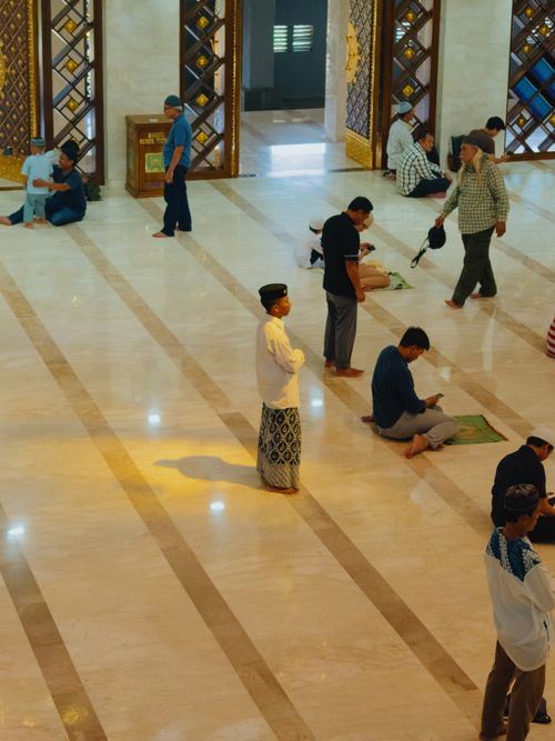 Free People inside a mosque in West Java, Indonesia, participating in prayer and reflection. Stock Photo