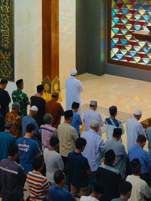 Free A group of men engaged in congregational prayer inside a mosque in Jawa Barat, Indonesia. Stock Photo