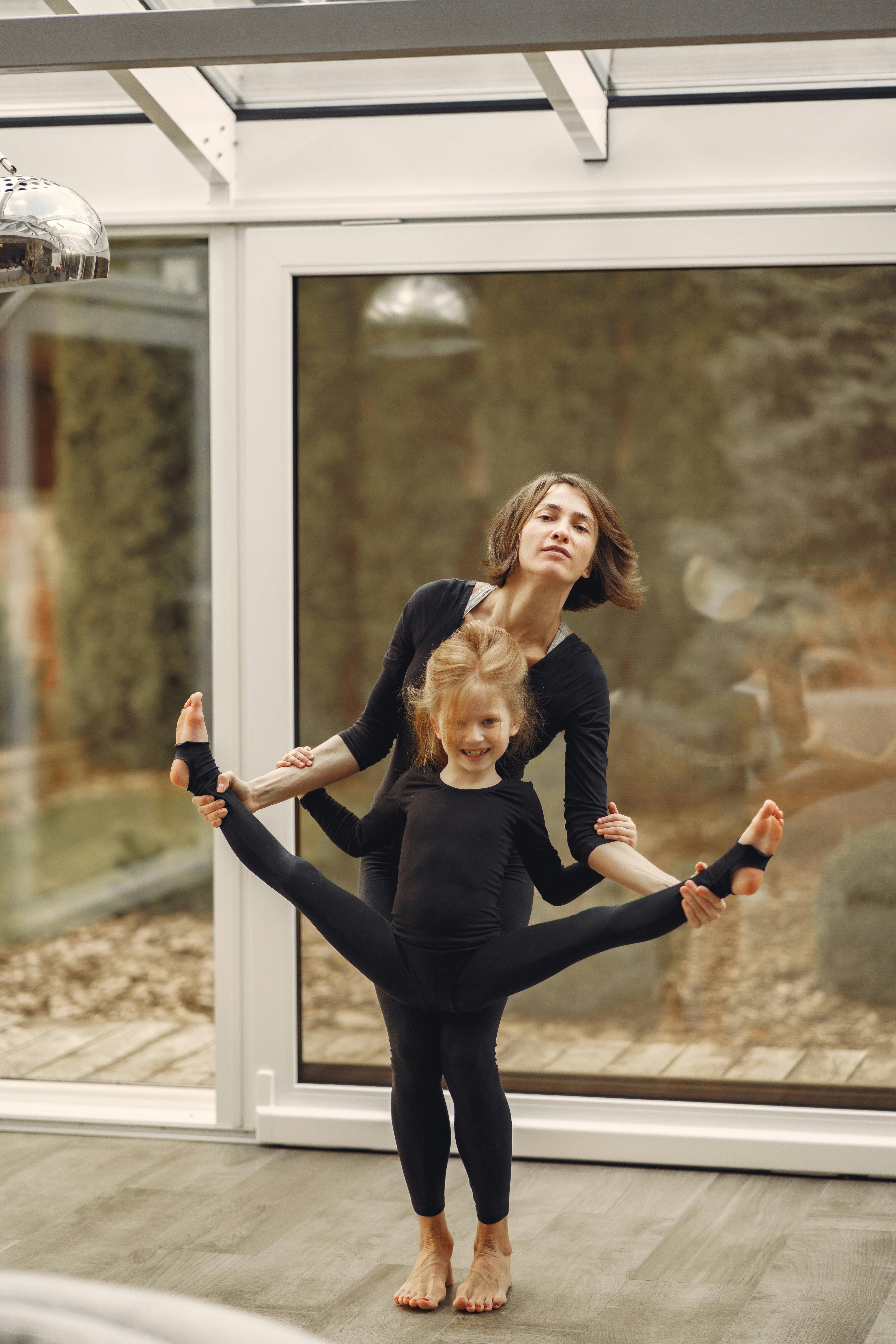 Woman And Little Girl In Black Long Sleeve Shirt And Black Leggings Doing  Split · Free Stock Photo
