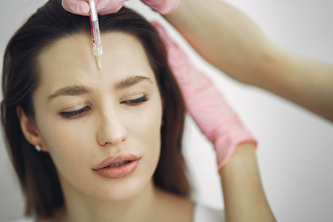 Free Woman Getting a Face Botox Stock Photo