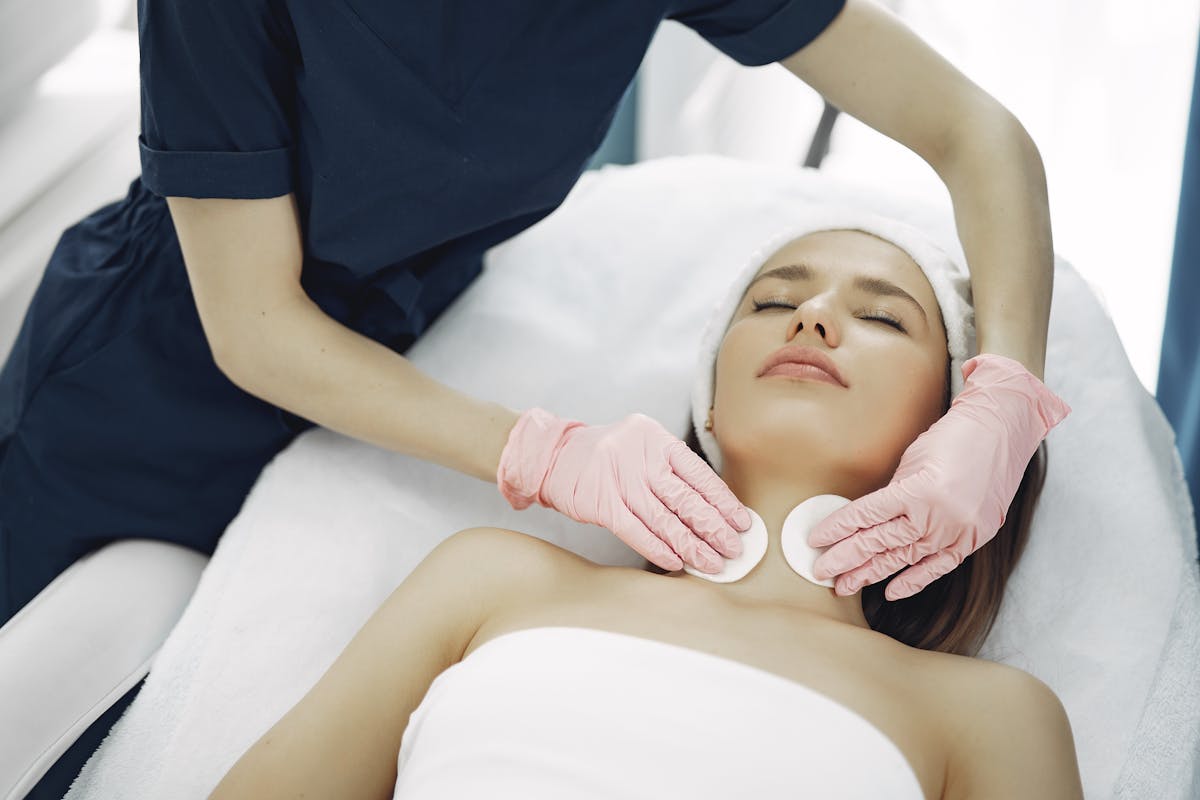Relaxed client during a soothing facial treatment