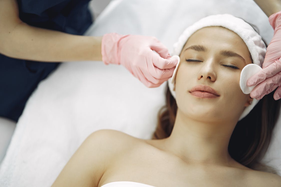 Free Woman Getting a Facial Treatment Stock Photo loose skin
