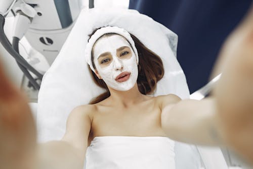 Woman With White Facial Mask