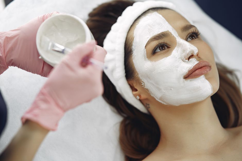 client relaxing with a calming facial mask on - acne facial client relaxing with a calming facial mask on - acne facial