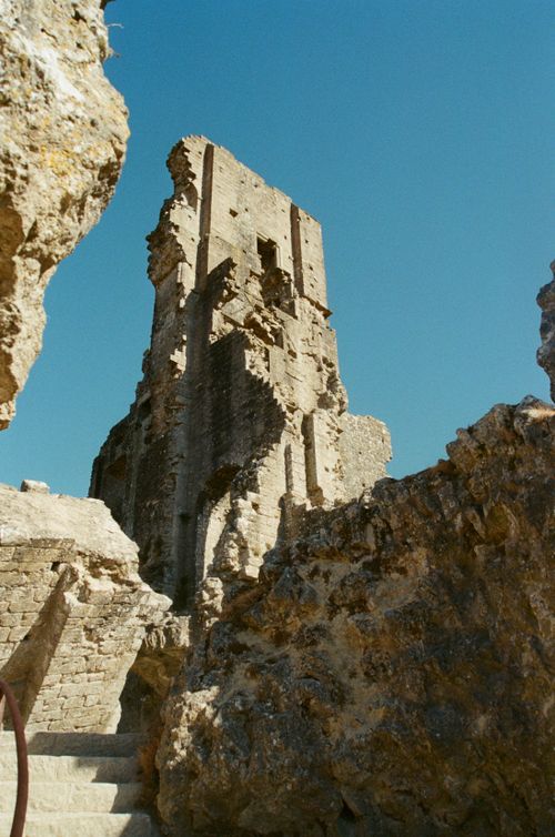 Free Explore the historic ruins of Corfe Castle under a clear blue sky. Stock Photo