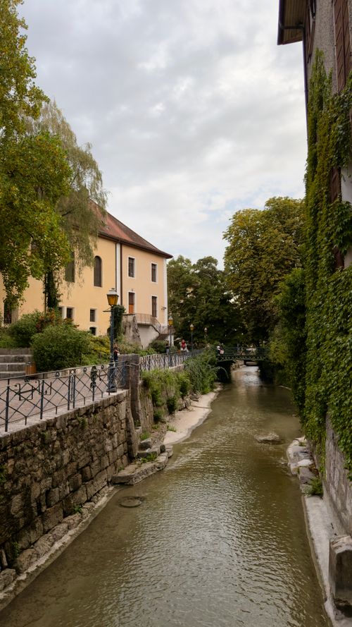 Free Explore the historic charm of Annecy's old town with its picturesque canal and stone walls. Stock Photo