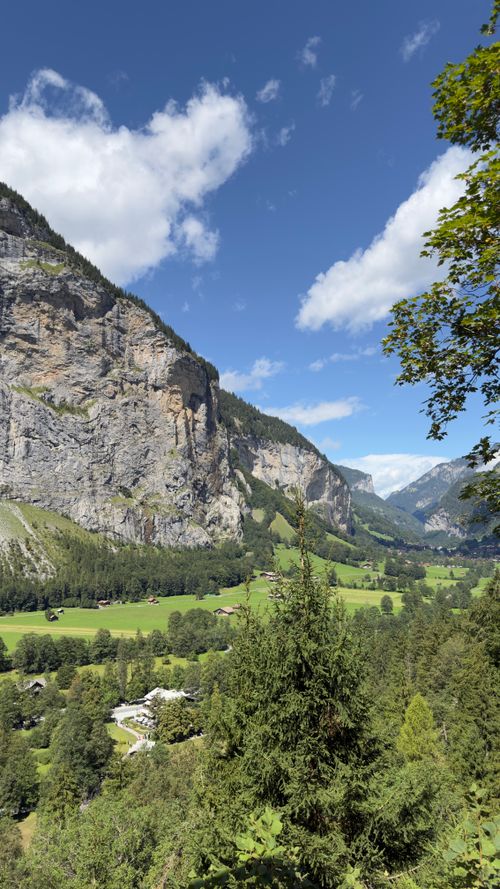 Free Stunning landscape of Lauterbrunnen, Switzerland with lush greenery and towering limestone cliffs. Stock Photo