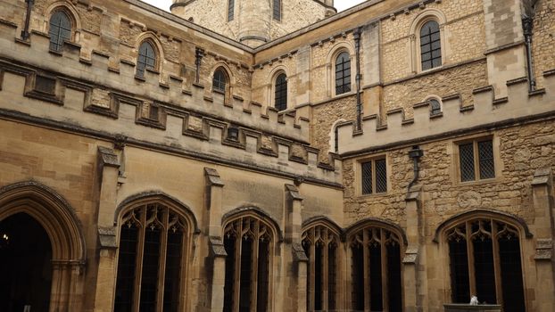 Gothic-style stone architecture at Oxford University courtyard, showcasing medieval design elements.
