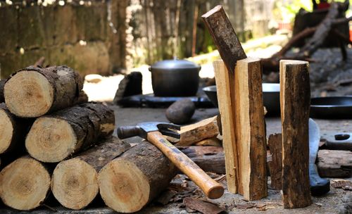 Free Chopped firewood with hammer outdoors, showcasing rustic tools in a natural setting. Stock Photo