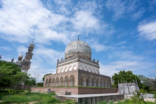 Free The majestic Qutb Shahi Tombs set against a bright blue sky in Hyderabad, India. Stock Photo