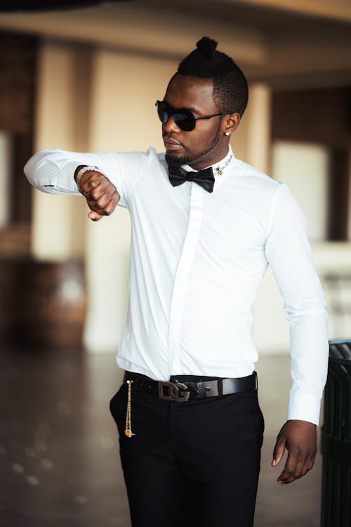 Man in White Dress Shirt and Black Pants Wearing Black Sunglasses