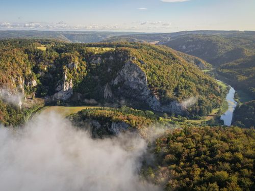 Free Breathtaking aerial shot of lush hills and river in Fridingen an der Donau, Germany. Stock Photo