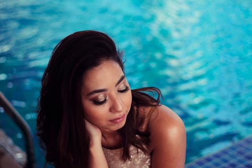 Woman By The Swimming Pool