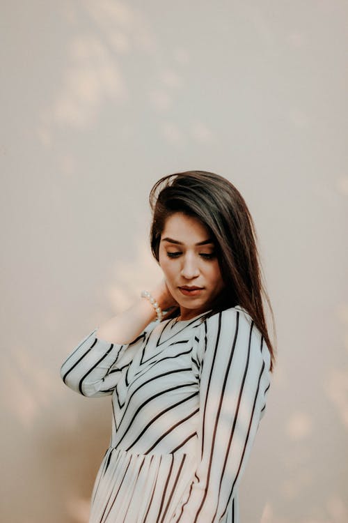 Woman In White And Black Striped Long Sleeve Clothing