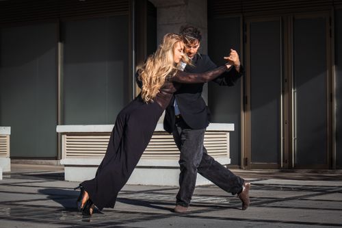 Free Couple dancing tango outdoors in Buenos Aires, showcasing elegance and passion. Stock Photo
